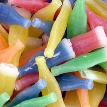 Colorful wax bottle candies filled with syrup